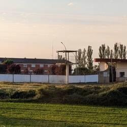 There is a lot of barbed wire around this, but the sign said "apartments". We have questions.