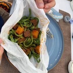 Shivit Ashsi—dill pasta dish where you add your own ingredients to the pasta and mix it up in paper