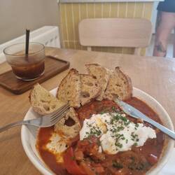 Shakshuka with iced coffee at Our Place.