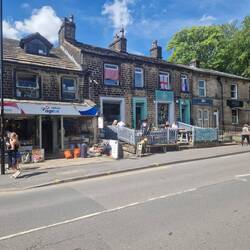 Uppermill highstreet. Vicky was very happy the Cake Kitchen did takeout 😋