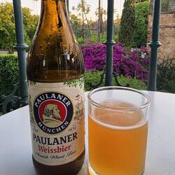 Enjoying a cold one on our balcony. Nice long nights here -- sunset was after 9:30pm.