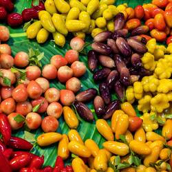 Luk Chup, a Thai dessert. It's shaped like miniature fruit and filled with mung bean paste. Yum!