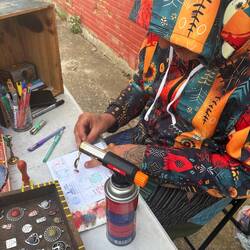 Wax stamp artist. We could pick one of four designs and the wax colors we wanted.