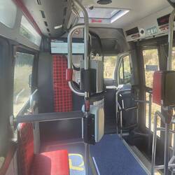 Inside the city bus from the farthest back seat