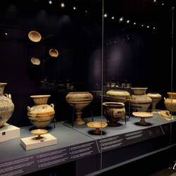 Collection of Orientalizing Period amphorae, plates w/stands, and urns.