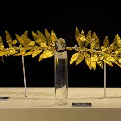 Gold myrtle leaves (Ephesus; Hellenistic Period) & glass necklace stone (Roman Period).