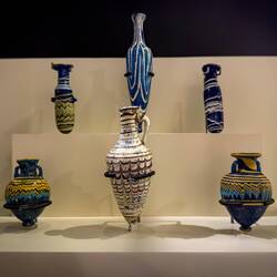 Painted glass amphoriskos and alabastron used to store/dispense scented oils, perfumes, and such.