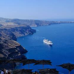 Three cruise ships in the bay.