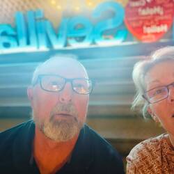 Trying to figure out how to take selfie in front of neon sign