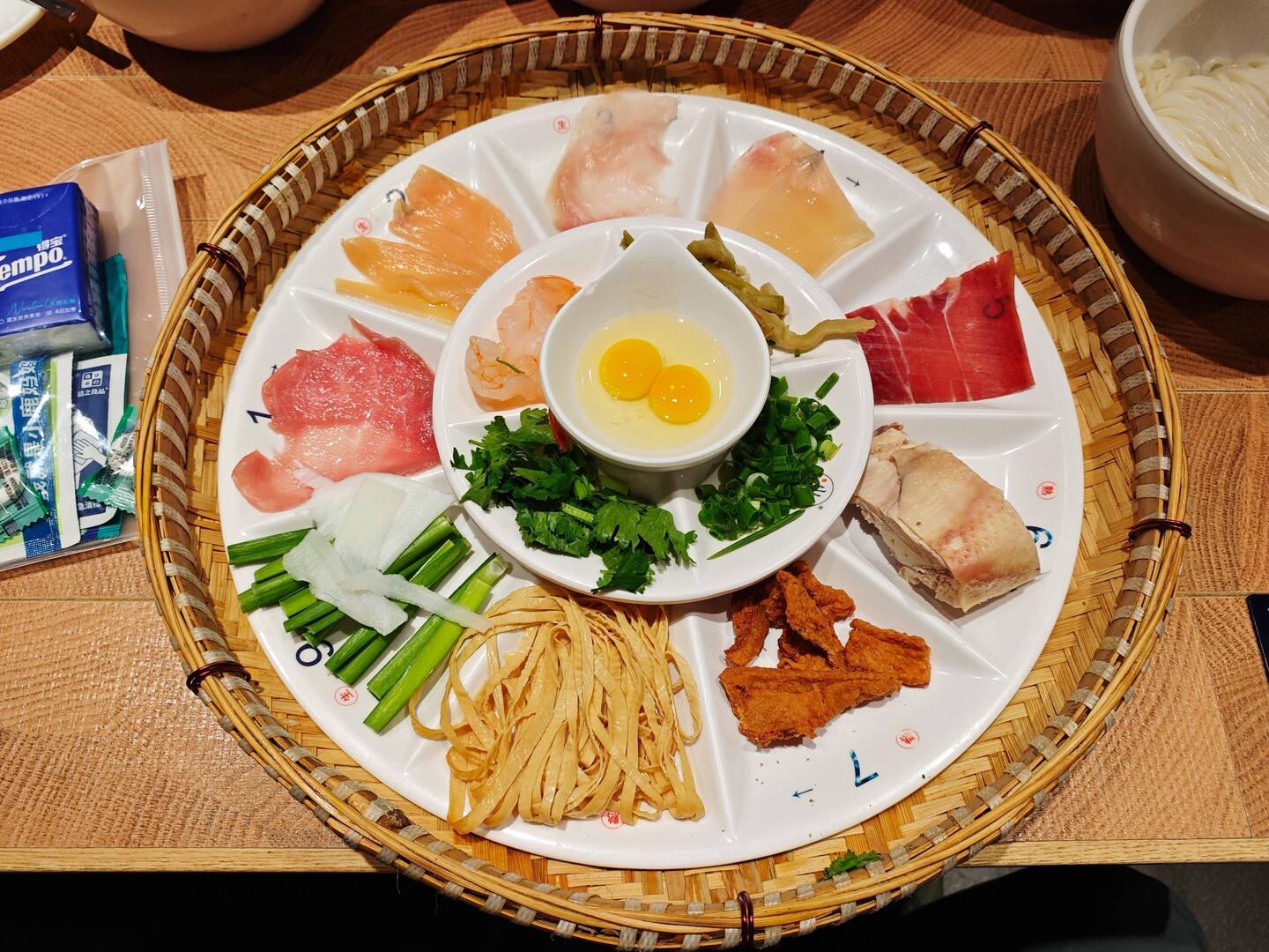 The soup base for cross-bridge rice noodles. 过桥米线的底料
