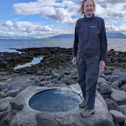 A hot tub on the rocky beach
