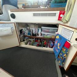 Plenty of storage under sink. Webasto heater, water heater, and diesel fuel tank.