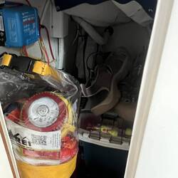 Far aft closet compartment. Ditch bag and solar controller. Tool and fishing boxes, etc.