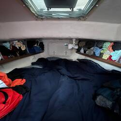 Looking into the V-Berth. When Rosanne is not with me, her side of the bed is more storage. LOL