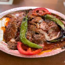 We each ordered a single-portion İskender döner ... Özev — Kemeraltı, İzmir.