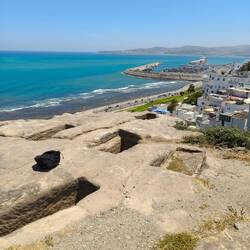 Phoenician tombs carved into the rock on clifftop