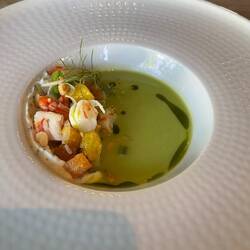 Green soup with pickled shrimp and peas