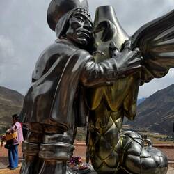 Statue depicting Inca hugging the sacred condor, puma and snake