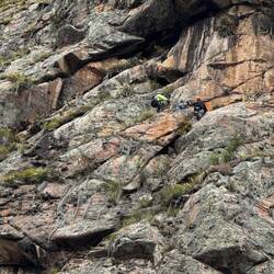 People climbing to get to their room