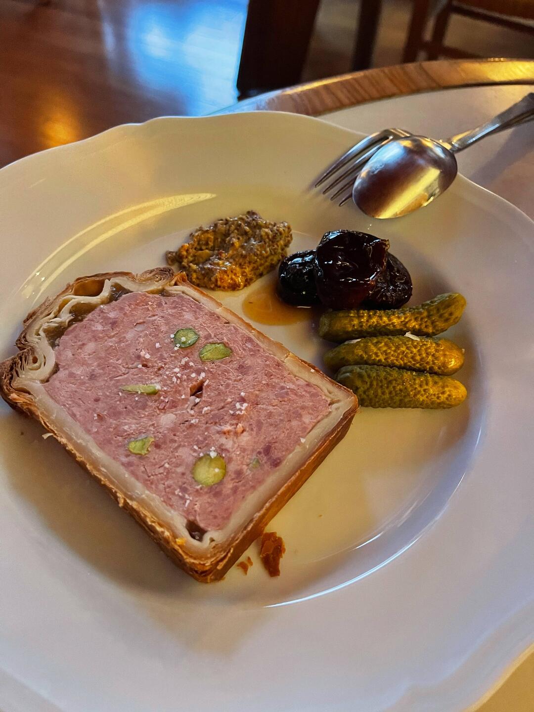 Pork pate en croute with pistachios, mustard and candied prunes
