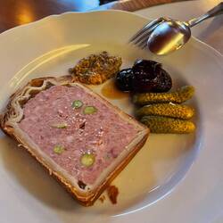 Pork pate en croute with pistachios, mustard and candied prunes