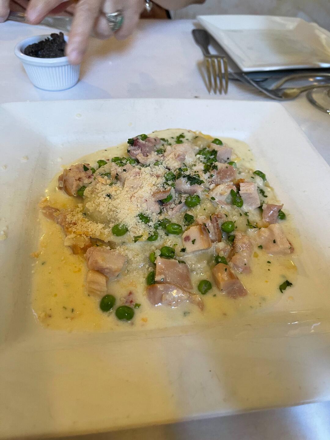 Mushroom ravioli with cream, peas, smoked chicken