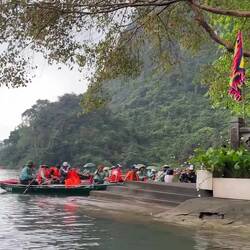 After visiting a remote ancient temple we cut through the limestone massif via river cave!