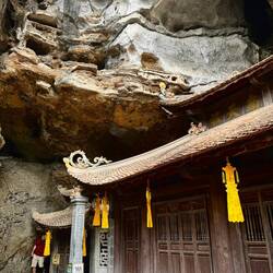 Small temple set into a cave mouth. It was exciting to go behind into the hidden passageway...