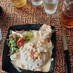 Joe's Favourite; Seafoods in garlic sauce, served on a flaguette bread with salad