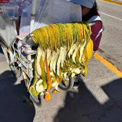 Lady selling orange juice. Look at the peels