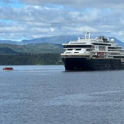 Another cruise ship in port today. One of its small boats taking passengers to tour the town.