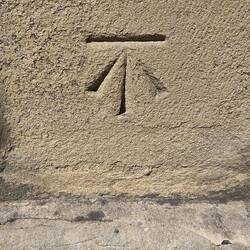 Benchmark on the Abbey wall