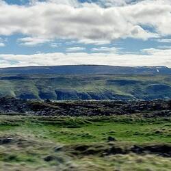 En route to Gudafoss; Pseudo-crater formed from lava pushing up from the ground