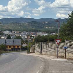 A rare downhill entrance into a town.