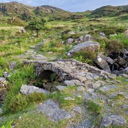 Arch foot bridge on 'Roman steps' path ascent from Cwm Bychan