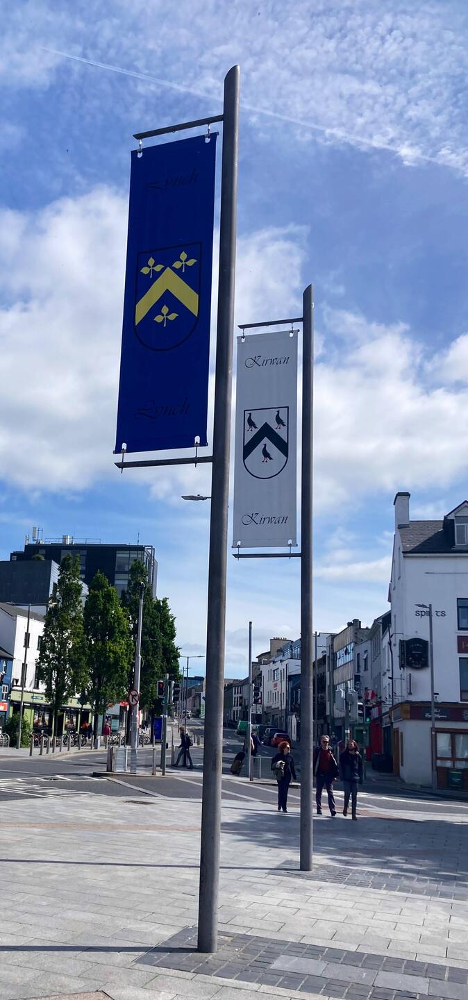 Family coat of arm banners hanging at Eyre Square