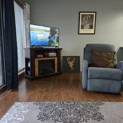 Living room. I already replaced the artwork with.our own.