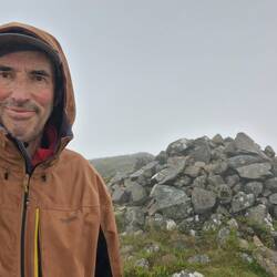 Cairn atop Rhinog Fach in low visibility and strong wind