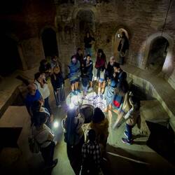 Our group listening to the guide; Mui is checking out one of the ducts — Bagni di Mario.