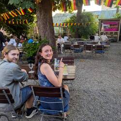 Found pub with beer garden + football. Jürgen Klopp punditing.