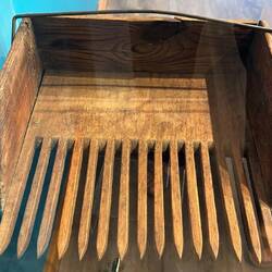 Wooden rake for collecting berries