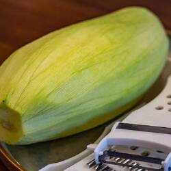 This cucumbery thing is actually a mango, not ripe yet. It's used as shavings for the salad.