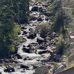 Climber crossing the creek.