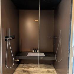 The shower doubles as a steam room, has a mist function & toggles therapeutic lighting and music