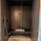 The shower doubles as a steam room, has a mist function & toggles therapeutic lighting and music