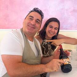 Roberto proudly shows off his picture on the wine label — Bologna, Italy.