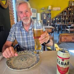 Pat, enjoying a well earned beer at Hotel Muja Tirana airport.