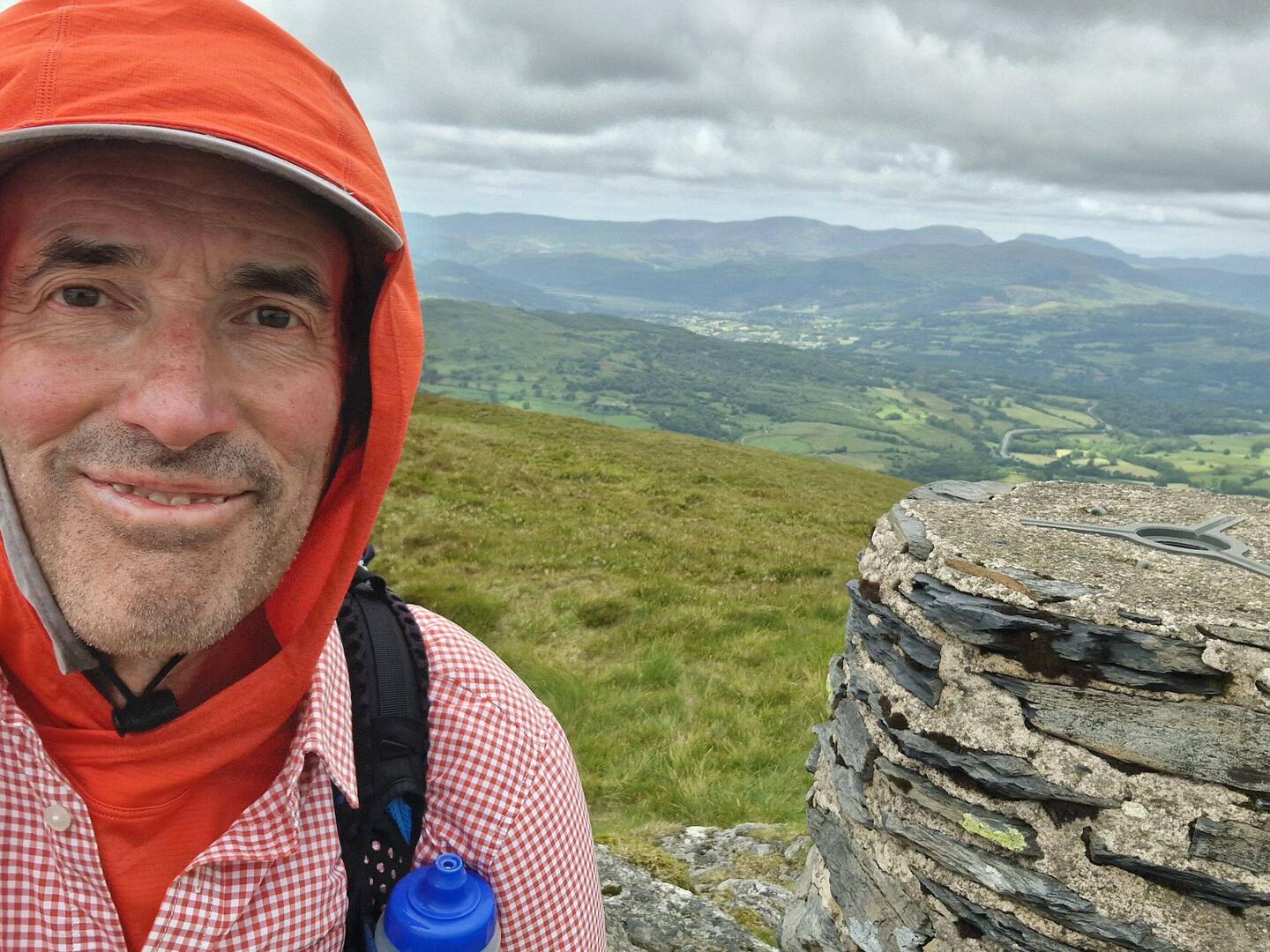 Waun-oer trig point looking NW. Dolgellau in the distance.