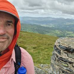 Waun-oer trig point looking NW. Dolgellau in the distance.