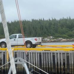 Work smarter: dragging the fuel hose by truck. Keep that nozzle clean! Hmm